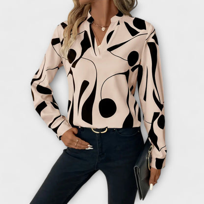Elegant blus med lång ärm och spetsig halsringning